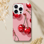 Coque iPhone Cerises Roses, illustration de cerises rouges sur fond rose.