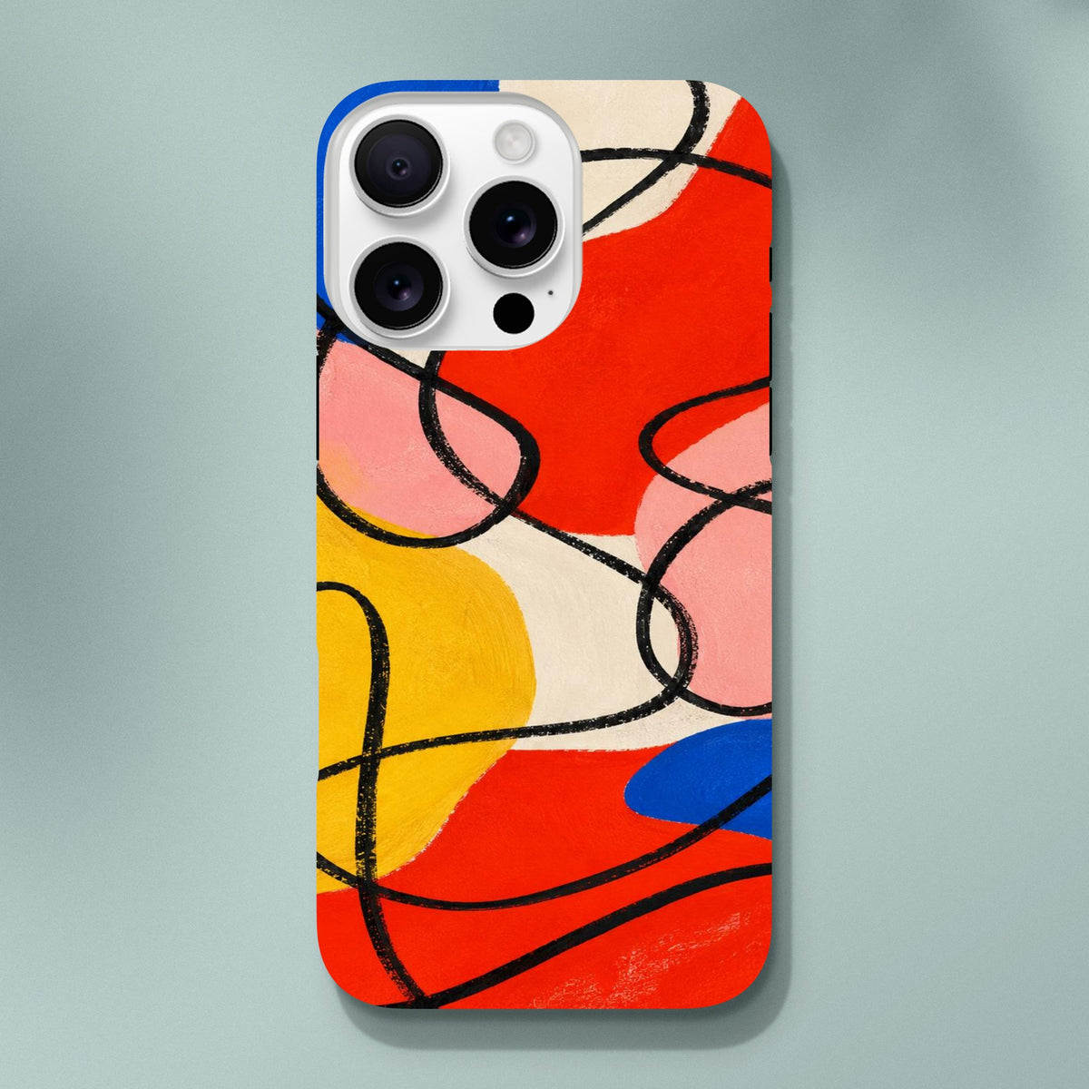 Coque iPhone Éclats géométriques, aplats rouges, jaunes, roses et bleus traversés de lignes noires.